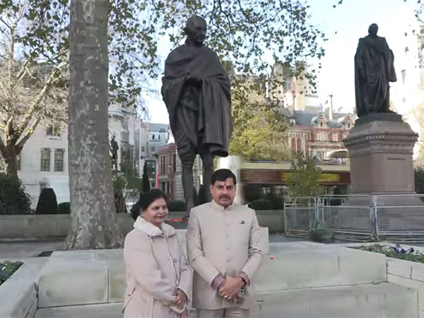 MP CM Mohan Yadav and his wife Seema Yadav at Mahatma Gandhi in Parliament Square gardens, London (Photo/ANI)