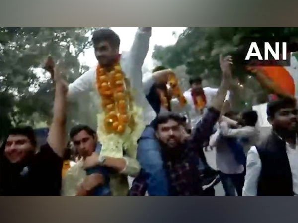 Visual of NSUI members celebrating with newly elected DUSU president Rounak Khatri. (Photo/ANI)