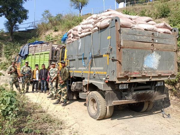 BSF Meghalaya apprehends four along with 2 trucks loaded with sugar worth Rs 10 lakh. (Photo/ANI)