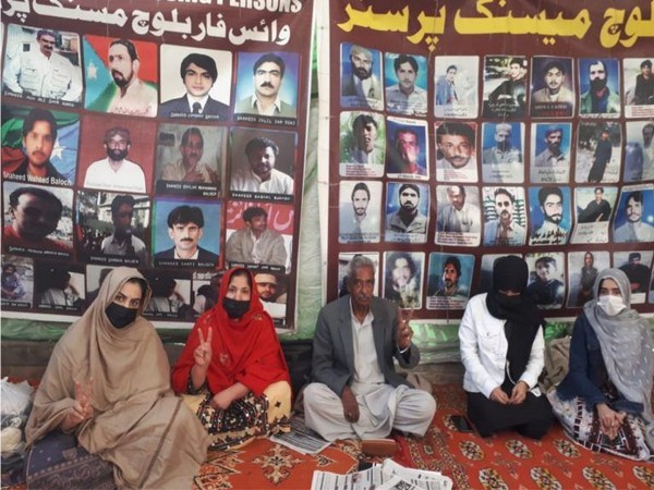 Residents of Parom, a town in the Panjgur district of Balochistan, staging a sit-in protest (Photo X/@TBPEnglish)