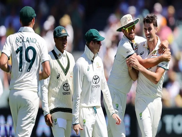 Pat Cummins celebrating with his Aussie teammates. (Picture: cricket.com.au)