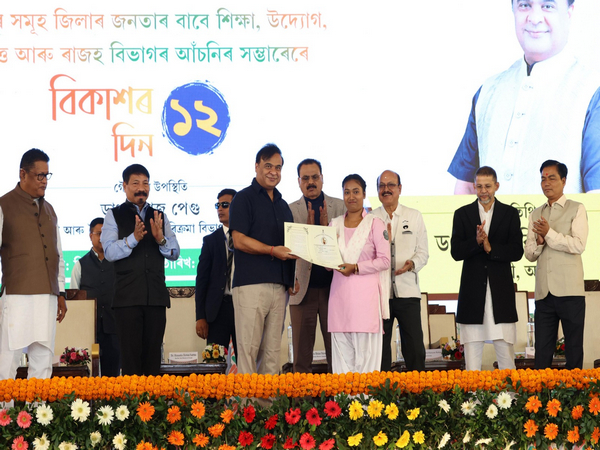 Assam CM Himanta Biswa Sarma awarding a female student (Photo/ANI) 