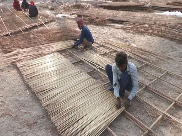 Artisans working to make huts (Photo/ANI)