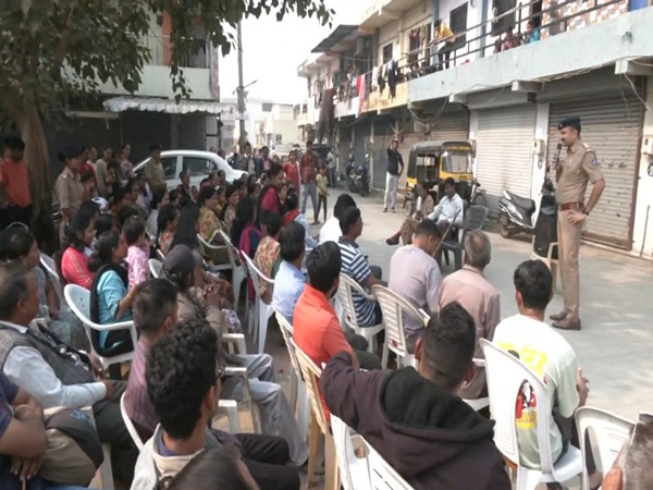 Personnel of Ichhapore Police Station interacting with people (Photo/ANI)