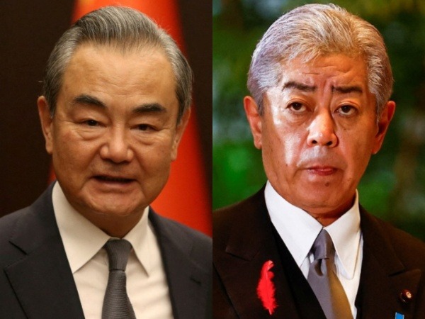 Chinese Foreign Minister Wang Yi and Japanese Foreign Minister Takeshi Iwaya (Photo credit: Reuters)