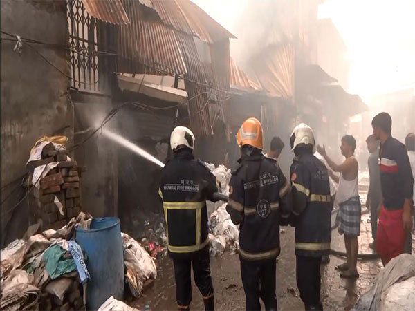 Firefighters work to control a Level 3 fire at Wajid Ali Compound in Kurla.(Photo/ANI)