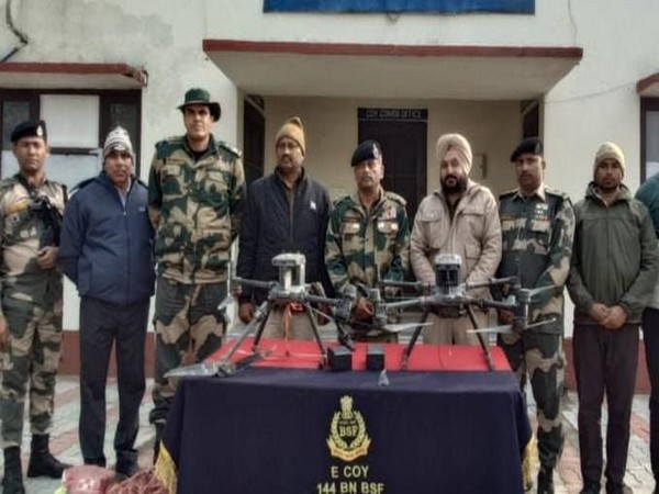 Troops of BSF Punjab with three recovered  Pakistani drones. (Pic/@BSF_Punjab)