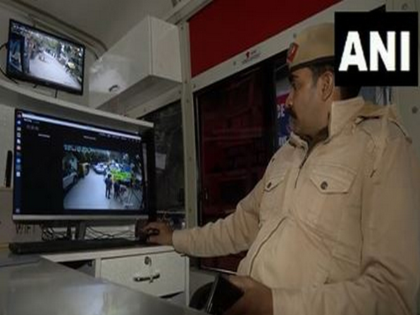 A Delhi Police personnel monitors security arrangements. (Photo/ANI)