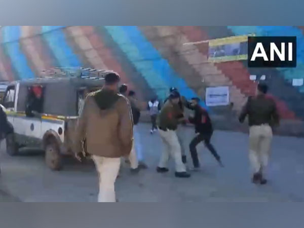 Police using lathi charge (Photo/ANI)