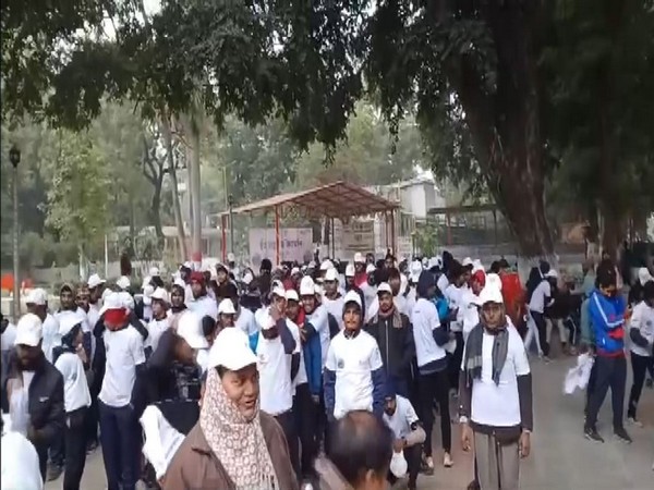 People participating in a walkathon ahead of Mahakumbh 2025 (Photo/ANI)
