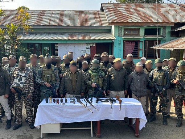 Security forces with seized weapons (Photo/ANI)