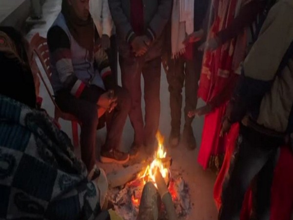 Visuals of people using bonfire to keep warm (File/Photo/ANI)