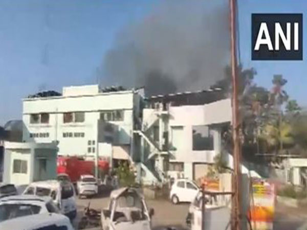 Smoke coming out of a building after broke out at a car showroom in Maharashtra's Jalgaon (Photo/ANI)