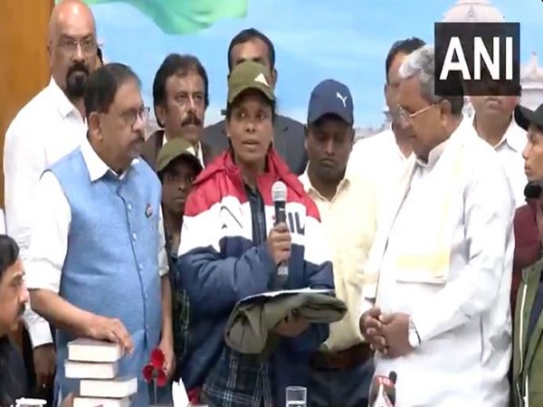 Six Naxals surrender before Karnataka CM Siddaramaiah in Bengaluru. (Photo/ANI)