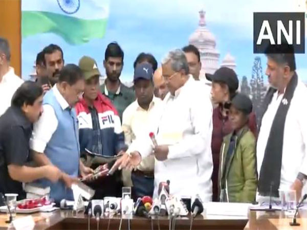 Six Naxals surrender before Karnataka CM Siddaramaiah in Bengaluru. (Photo/ANI)