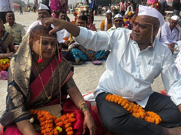 Couples perform the traditional 