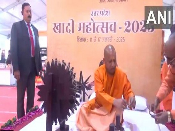  UP CM Yogi Adityanath spins the Charkha as he inaugurates the 'Khadi Mahotsav 2025' in Lucknow. (Photo/ANI)