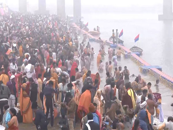 Devotees take holy dip at Triveni Sangam on auspicious occasion of Paush Purnima. (Photo/ANI)