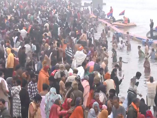 Devotees gather to take holy dip at Sangam. (Photo/ANI)