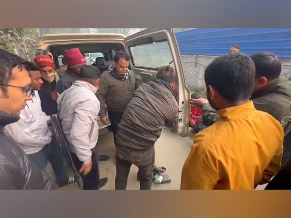 Assam police officials with the seized car (Photo/ANI)