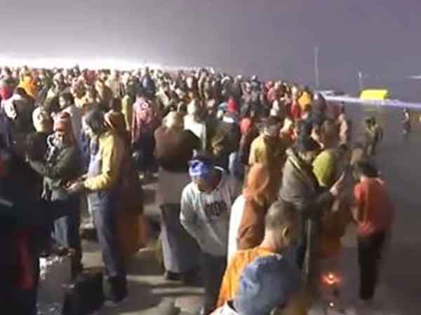 Devotees take holy dip at Triveni Sangam on the fourth day of Maha Kumbh (Photo/ANI)
