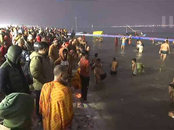 Devotees take a dip at the Sangam (Photo/ANI)