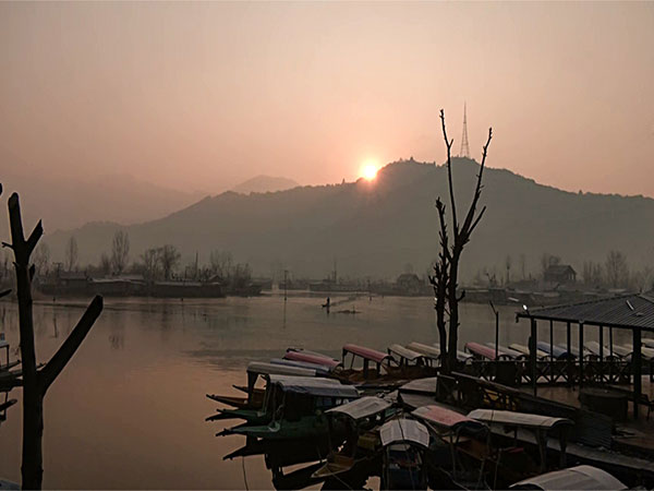 A thin layer of ice forms on the Dal Lake as cold wave continues in the Kashmir Valley (Photo/ANI)