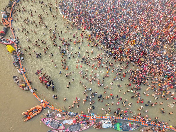 A photo of devotees taking a dip in the Triveni Sangam at Maha Kumbh Mela (Photo/ANI) 