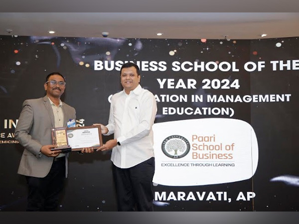 Nitish Harihar, Chairman of R P Sarathy Institute of Technology & Founder of Nithara Coffee giving award to Prof. Dharma Teja, Programme Director for Paari School of Business