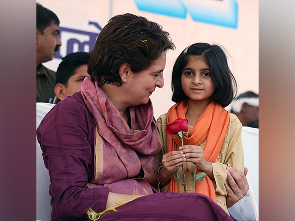 Priyanka Gandhi Vadra with a girl child during a public meeting (FilePhoto/ANI)