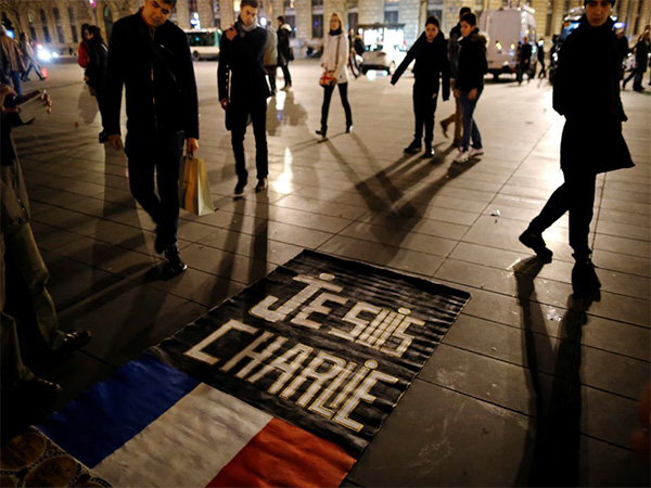 People gather on the Place de la Republique square to pay tribute to the victims of shooting at the French satirical newspaper Charlie Hebdo (Photo: Reuters)