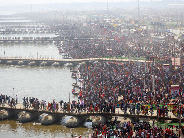 Devotees throng at Triveni Sangam to take a dip during the ongoing Mahakumbh (Photo/ANI)