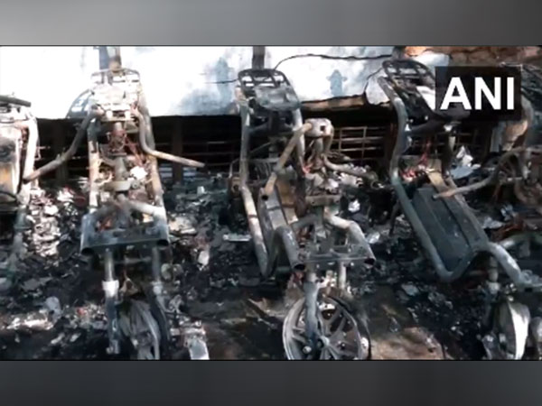 A fire breaks out at the Okinawa electric bike showroom in Bengaluru. (Photo/ANI)