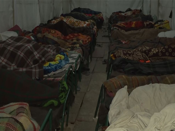 People take refuge in night shelter homes as cold weather continues. (Photo/ANI)