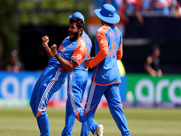 Jasprit Bumrah celebrating with teammates after taking a wicket (Photo: Olympics.com)