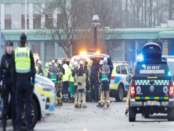 Police officers gathered at the shooting site (Image/Reuters)
