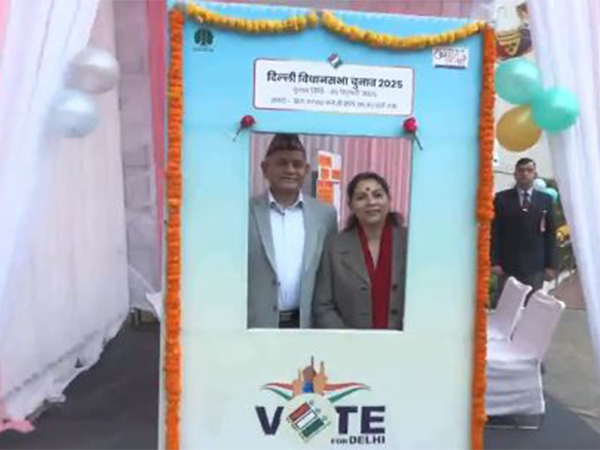Indian Army Chief General Upendra Dwivedi and his wife click a photo at a selfie booth at a polling booth at K. Kamraj Lane (Photo/ANI)