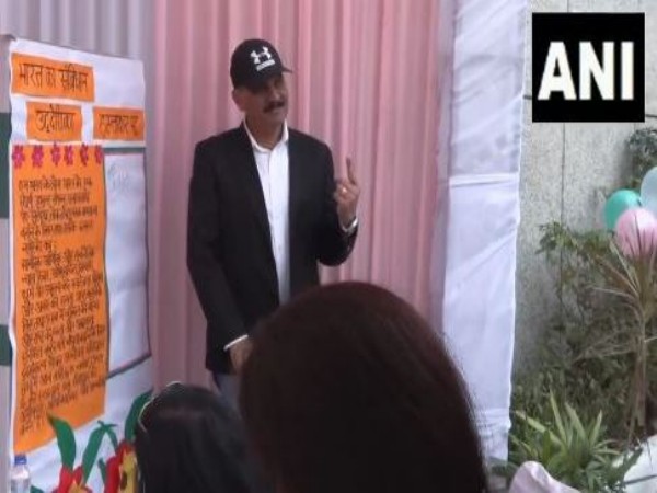 Navy Chief Admiral Dinesh K Tripathi shows his inked finger after casting his vote (Photo/ANI)