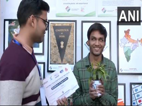 Visually impaired youngster gifted sapling after casting his vote. (Photo/ANI)