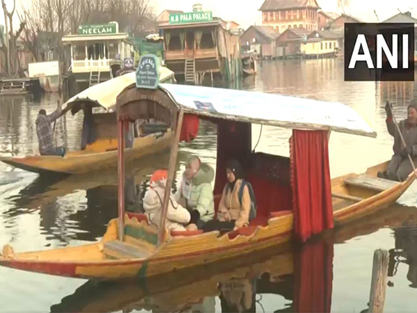 Tourists embrace winter chill with shikara rides on Dal Lake (Photo/ANI)