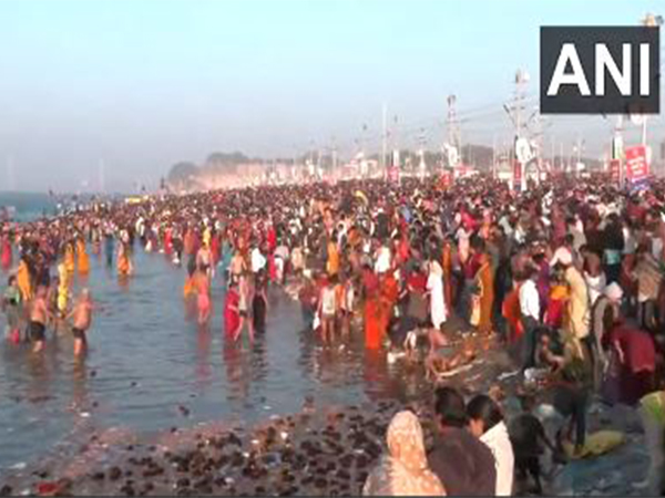 Devotees take a holy dip (Photo/ANI) 
