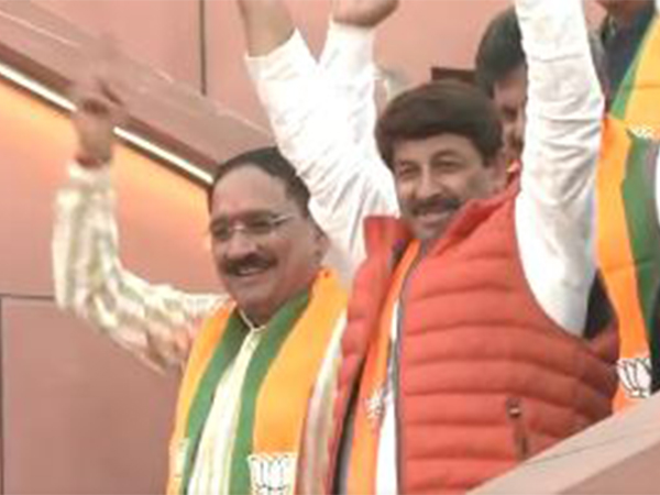 BJP President Virendra Sachdeva and MP Manoj Tiwari celebrate the party's win (Photo/ANI)