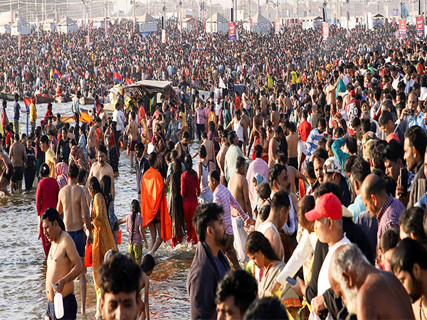 Devotees gather to take a dip at Triveni Sangam during the ongoing 'MahaKumbh', in Prayagraj (Photo/ANI)