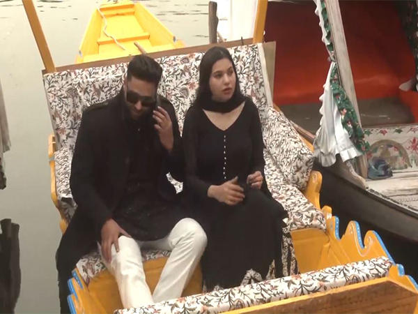 Tourists enjoy Shikara ride on Dal Lake on Monday. (Photo/ANI)