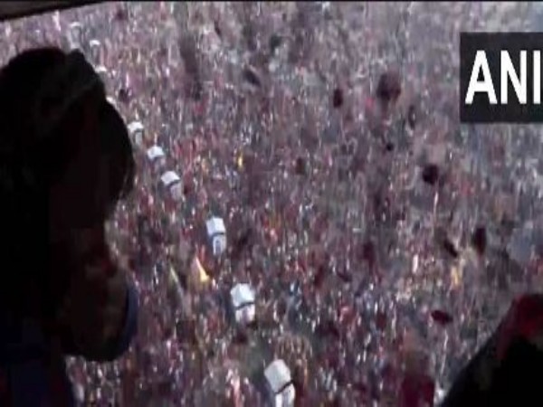 Visuals of flower petals showered on the devotees and ascetics (Photo/ANI) 