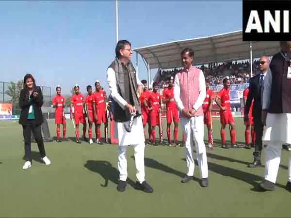 CM Dhami tries his hand at Hocley (Photo/ANI)