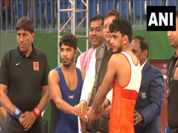 CM Dhami with wrestlers at National Games (Photo/ANI)