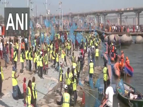 Visuals of sanitation workers cleaning the ghats of Triveni Sangam (Photo/ANI) 