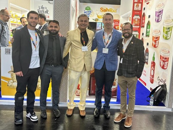 Sion (left), Zardar Badami (second left), Amit Sawhney (center), Ernesto Riaño (second right), and Gustavo Rendon (right) together at the event