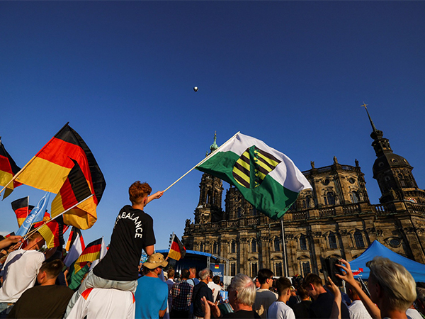 Alternative for Germany supporters wave party's flag (Image/Reuters)